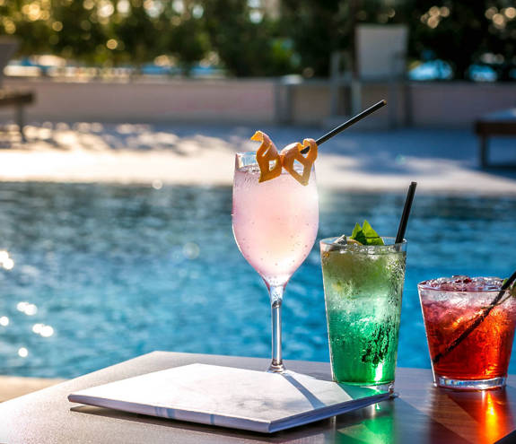 Oasis Pool Bar drinks with the pool in the background