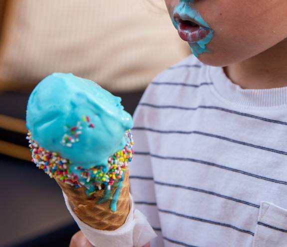 A child eating a Bufala Gelato ice cream cone