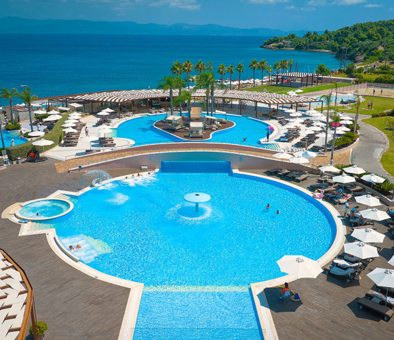 The three pools with sunbeds and umbrellas
