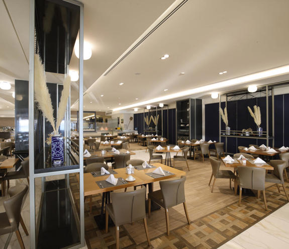 Bright seating area inside Kritamo restaurant with elegant design and cozy seating