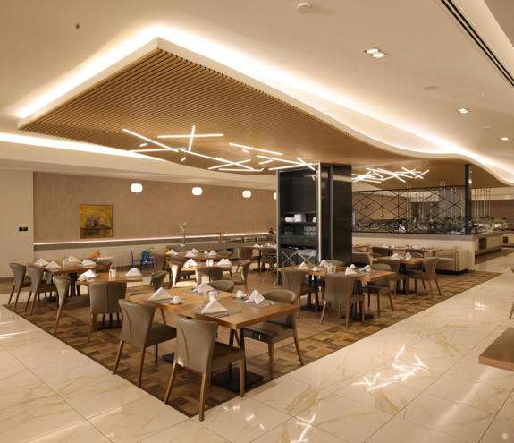 Bright interior of Kritamo restaurant with modern wooden designed accents and cozy seating